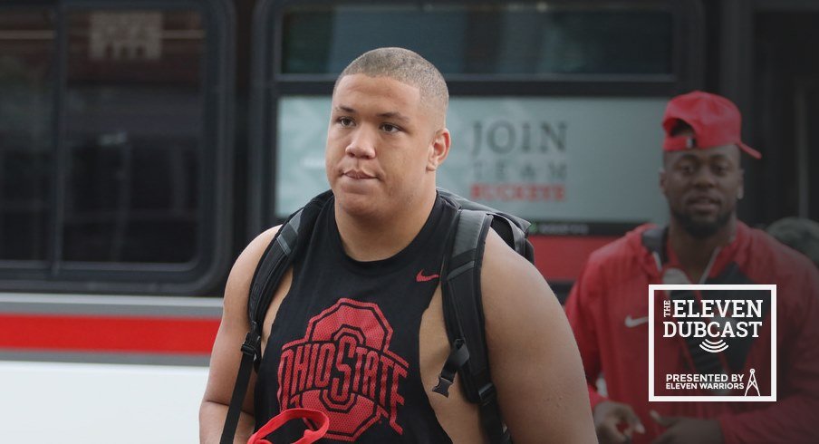 Ohio State football players check into fall camp.