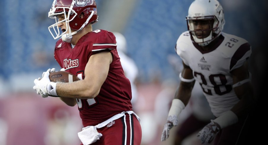 Sep 24, 2016; Foxborough, MA, USA; Massachusetts Minutemen tight end Adam Breneman (81) is pursued by Mississippi State Bulldogs line backer DeAndre Ward (28) during the third quarter at Gillette Stadium. Mississippi State won 47-35. Credit: Greg M. Cooper-USA TODAY Sports