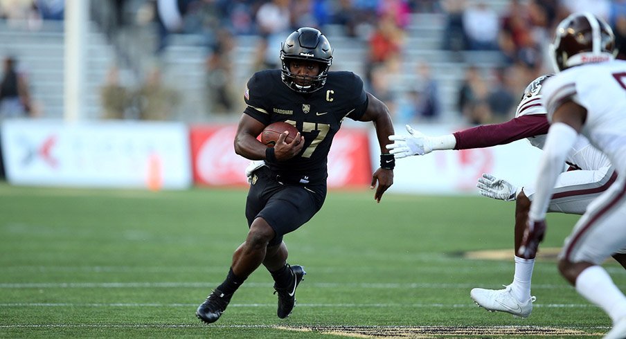 Army Black Knights quarterback Ahmad Bradshaw (17) rushes the ball against the Fordham Rams during the first half at Michie Stadium.