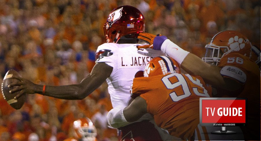 Oct 1, 2016; Clemson, SC, USA; Louisville Cardinals quarterback Lamar Jackson (8) is brought down by Clemson Tigers defensive end Clelin Ferrell (99) and defensive tackle Scott Pagano (56) during the first quarter at Clemson Memorial Stadium. Mandatory Credit: Joshua S. Kelly-USA TODAY Sports