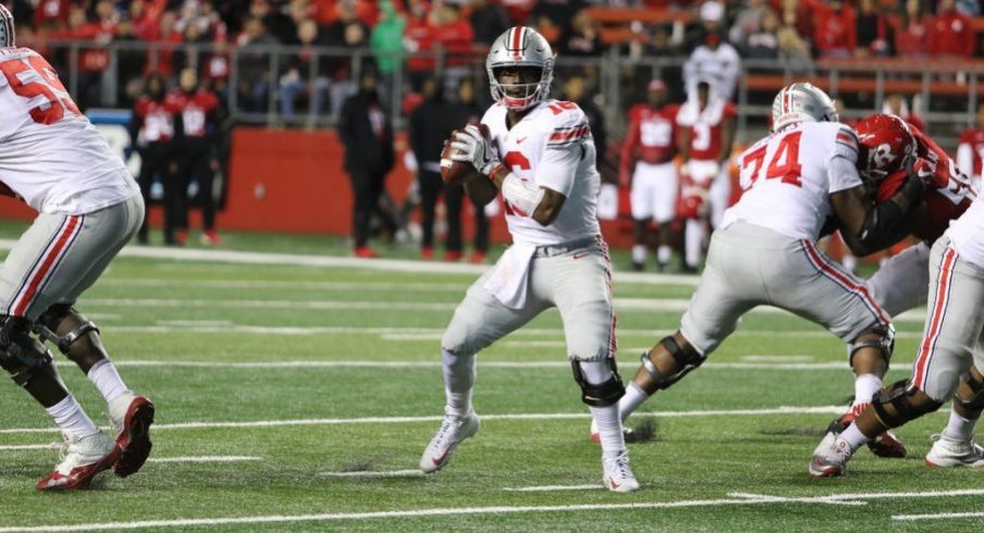 J.T. Barrett became Ohio State's career passing leader as the Buckeyes routed Rutgers.