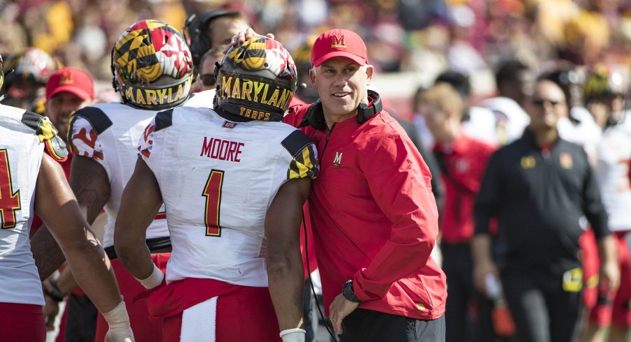 Sep 30, 2017; Minneapolis, MN, USA; Maryland Terrapins head coach DJ Durkin celebrates with wide receiver D.J. Moore (1) after a touchdown in the first half against the Minnesota Golden Gophers at TCF Bank Stadium. Mandatory Credit: Jesse Johnson-USA TODAY Sports