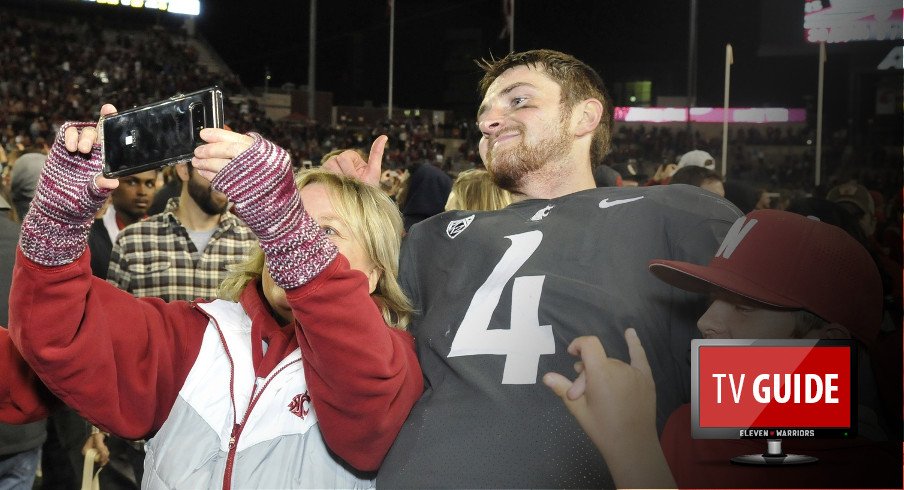 Sep 29, 2017; Pullman, WA, USA; Washington State Cougars quarterback Luke Falk (4) takes a selfie with a fan after a game against the USC Trojans during the second half at Martin Stadium. The Cougars won 30-27. Mandatory Credit: James Snook-USA TODAY Sports