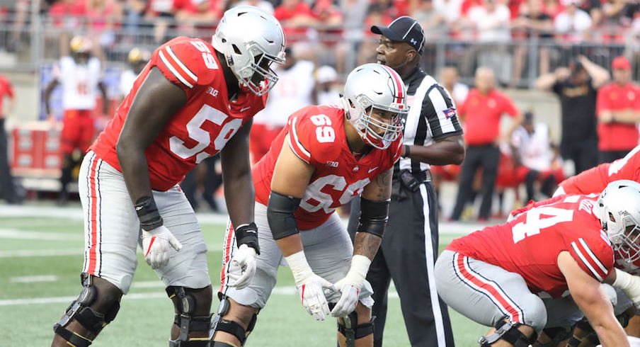 Matthew Burrell (69) played right guard alongside Billy Price (54) and Isaiah Prince (59) against Maryland.
