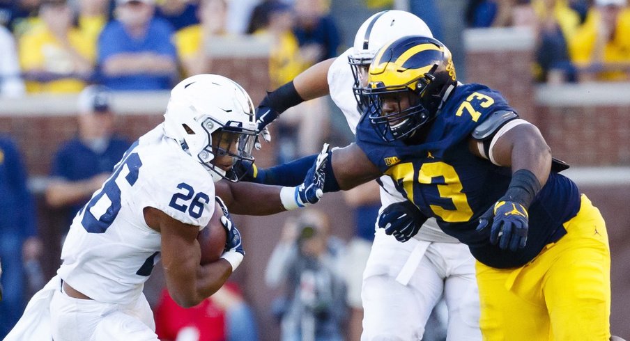 Maurice Hurst (73) and the Michigan Wolverines will look for another win over Saquon Barkley (26) and the Penn State Nittany Lions tonight.