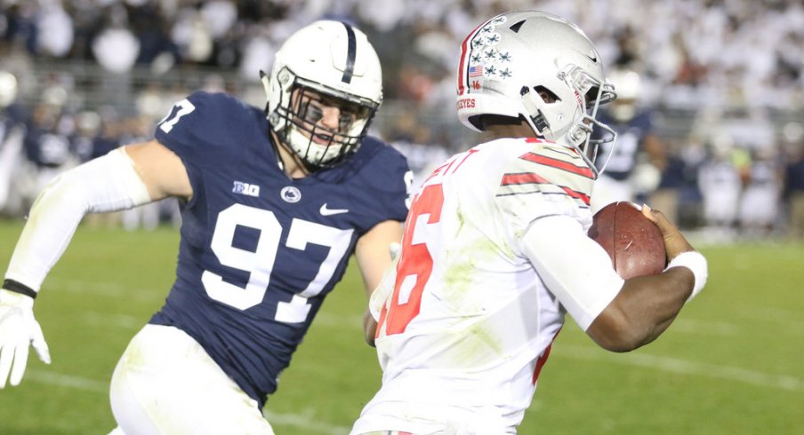 JT Barrett chased by Penn State defender