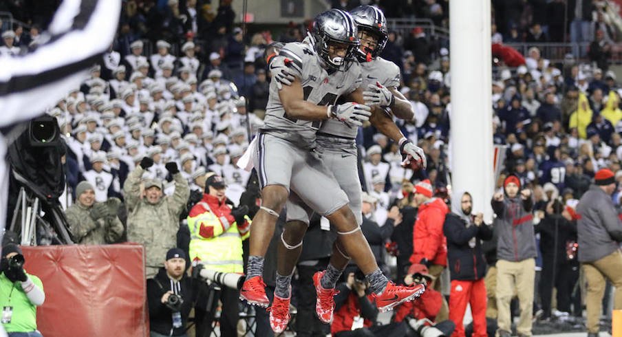 K.J. Hill and Johnnie Dixon celebrate one of the Buckeyes' three fourth-quarter touchdowns.