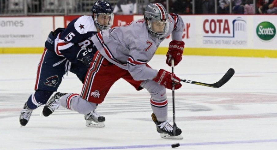 Buckeye defenseman Wyatt Ege carries the puck against Robert Morris. 