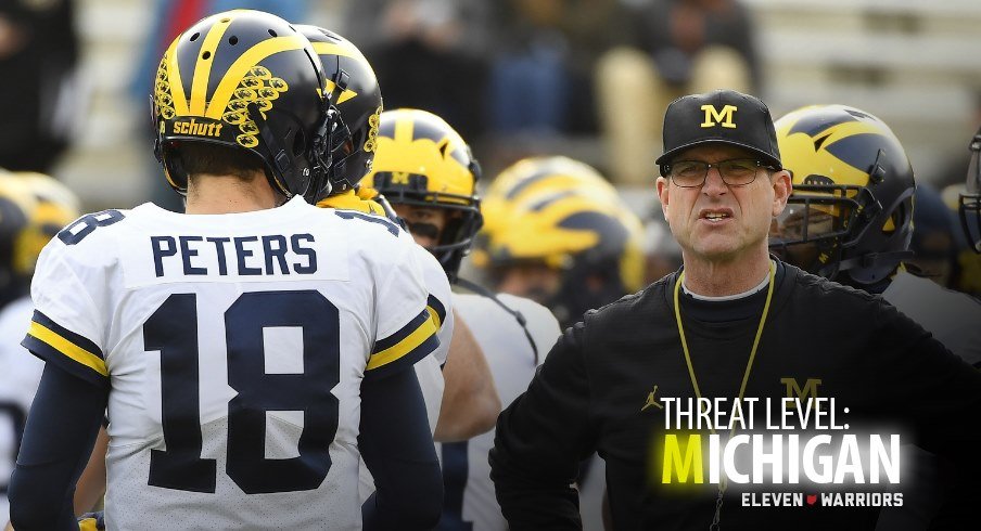 Michigan quarterback Brandon Peters and Michigan head coach Jim Harbaugh