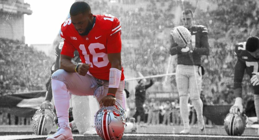 Nov 11, 2017; Columbus, OH, USA; Ohio State Buckeyes quarterback J.T. Barrett (16) kneels before a game against the Michigan State Spartans at Ohio Stadium. Mandatory Credit: Joe Maiorana-USA TODAY Sports