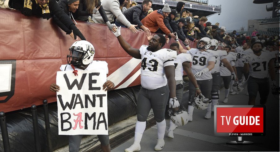  Nov 18, 2017; Philadelphia, PA, USA; UCF Knights wide receiver Emmanuel Logan-Greene, left, holds a sign as teammates celebrate a victory against the Temple Owls with fans at Lincoln Financial Field. Mandatory Credit: Derik Hamilton-USA TODAY Sports
