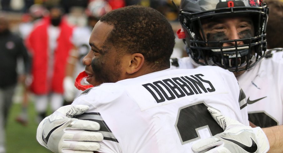 In his first Michigan game, J.K. Dobbins ran for 101 yards and a touchdown.