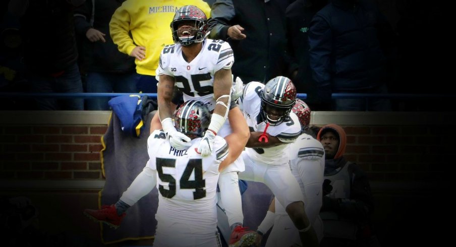 Nov 25, 2017; Ann Arbor, MI, USA; Ohio State Buckeyes running back Mike Weber (25) celebrates after his touchdown with offensive lineman Billy Price (54) and wide receiver Binjimen Victor (9) during the second half of Ohio State's 31-20 win over Michigan at Michigan Stadium. Mandatory Credit: Winslow Townson-USA TODAY Sports