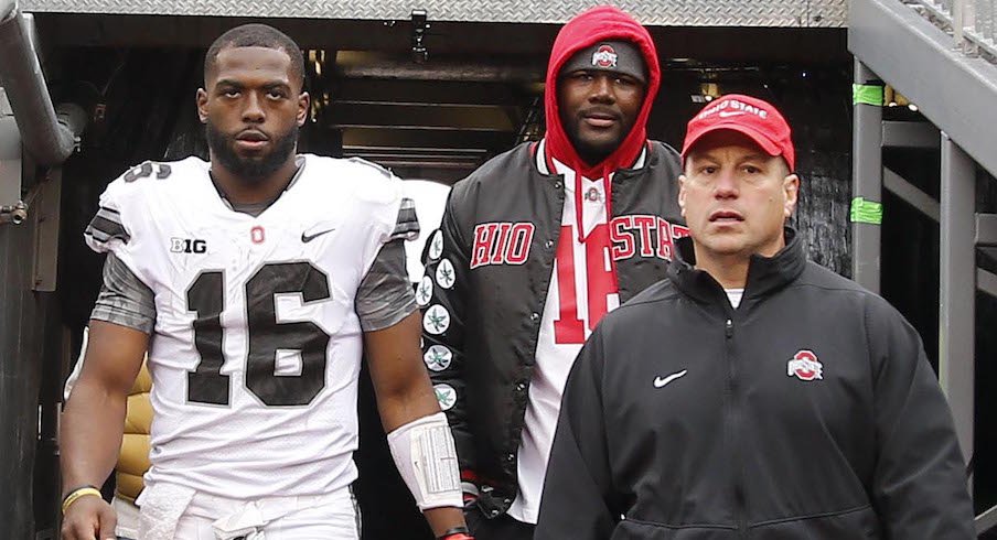 J.T. Barrett, Cardale Jones and Mickey Marotti emerge from the locker room after Barrett left Saturday's game with an injury.