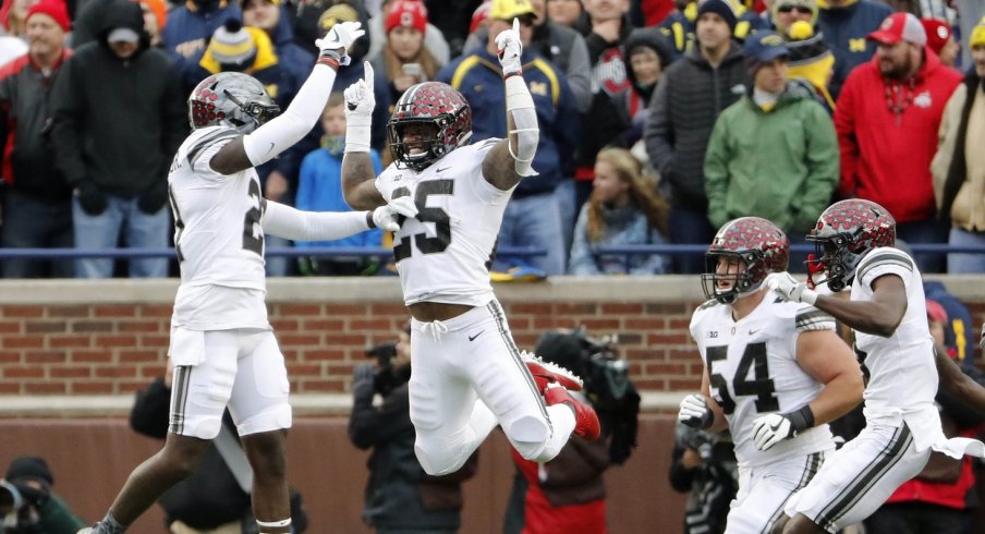 Nov 25, 2017; Ann Arbor, MI, USA; Ohio State Buckeyes running back Mike Weber (25) celebrates with wide receiver Parris Campbell (21) after his touchdown during the second half of Ohio State's 31-20 win over Michigan at Michigan Stadium. Mandatory Credit: Winslow Townson-USA TODAY Sports