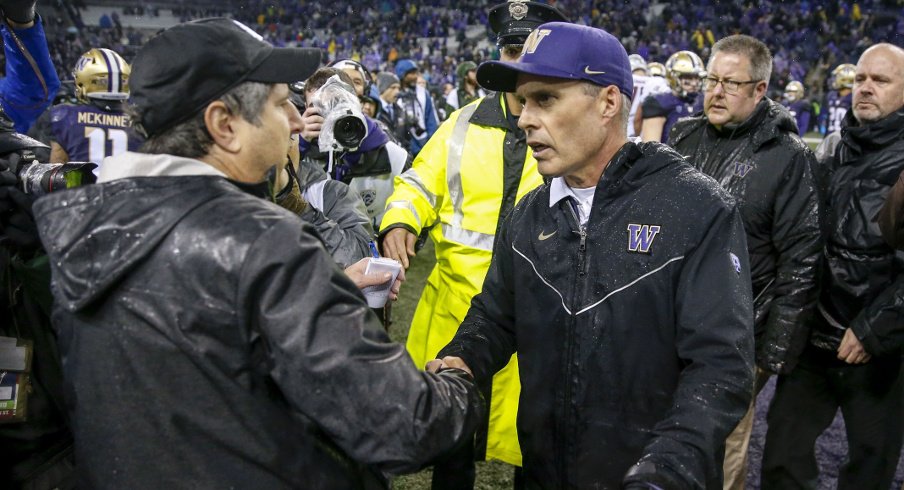 Nov 25, 2017; Seattle, WA, USA; Washington State Cougars head coach Mike Leach (left) shakes hands with Washington Huskies head coach Chris Petersen after their game at Husky Stadium. Mandatory Credit: Jennifer Buchanan-USA TODAY Sports