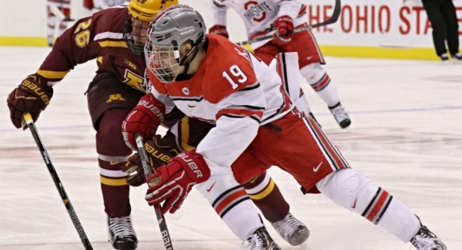 Buckeye forward Kevin Miller battles the Gophers. 