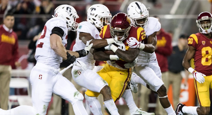 Dec 1, 2017; Santa Clara, CA, USA; USC Trojans running back Ronald Jones II (25) is tackled by the Stanford Cardinal in the second quarter of the Pac-12 Conference championship game at Levi's Stadium. Mandatory Credit: John Hefti-USA TODAY Sports