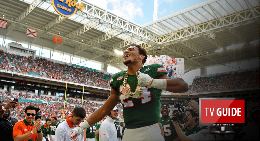 Nov 18, 2017; Miami Gardens, FL, USA; Miami Hurricanes running back Travis Homer (24) celebrates while wearing the turnover chain after recovering a fumble Virginia Cavaliers during the first half at Hard Rock Stadium. Mandatory Credit: Jasen Vinlove-USA TODAY Sports