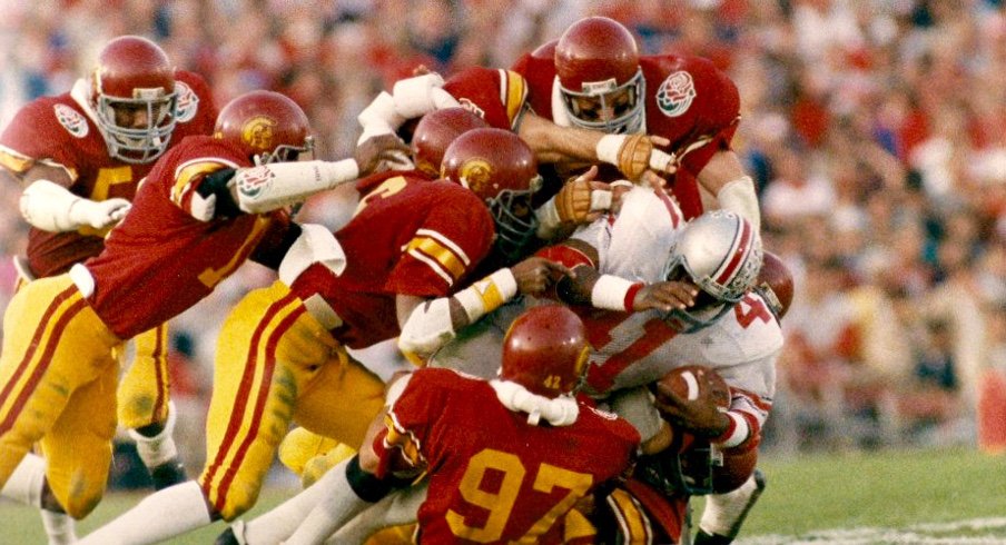 Keith Byars gang-tackled by USC in the 1985 Rose Bowl. (Inside USC)
