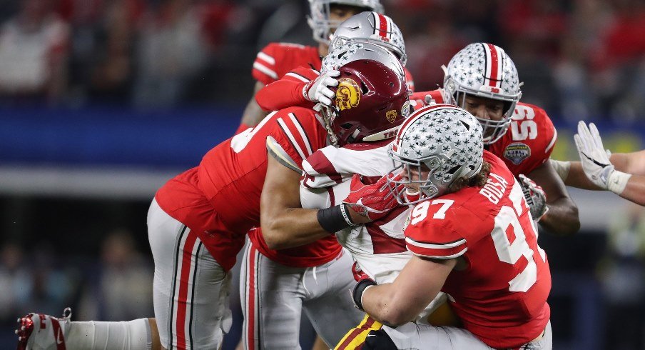 The Ohio State defense wraps up USC running back Ronald Jones in the 2017 Cotton Bowl.