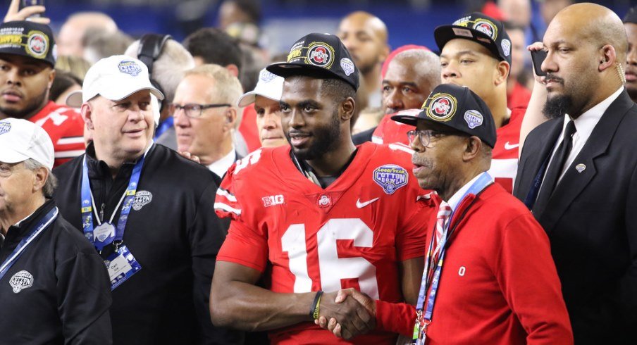 Ohio State quarterback J.T. Barrett and Ohio State president Michael Drake