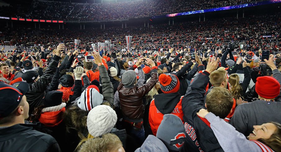 Ohio State fans celebrate on the Ohio Stadium field after the Buckeyes' 39-38 win over Penn State.
