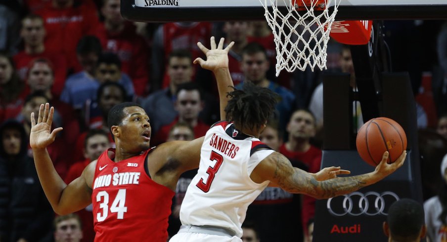 Kaleb Wesson defends a shot by Rutgers' Corey Sanders.