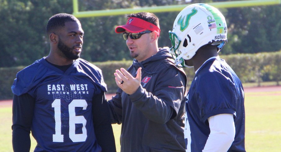 Zack Grossi (middle) coaches J.T. Barrett and USF quarterback Quinton Flowers at the East-West Shrine Game.