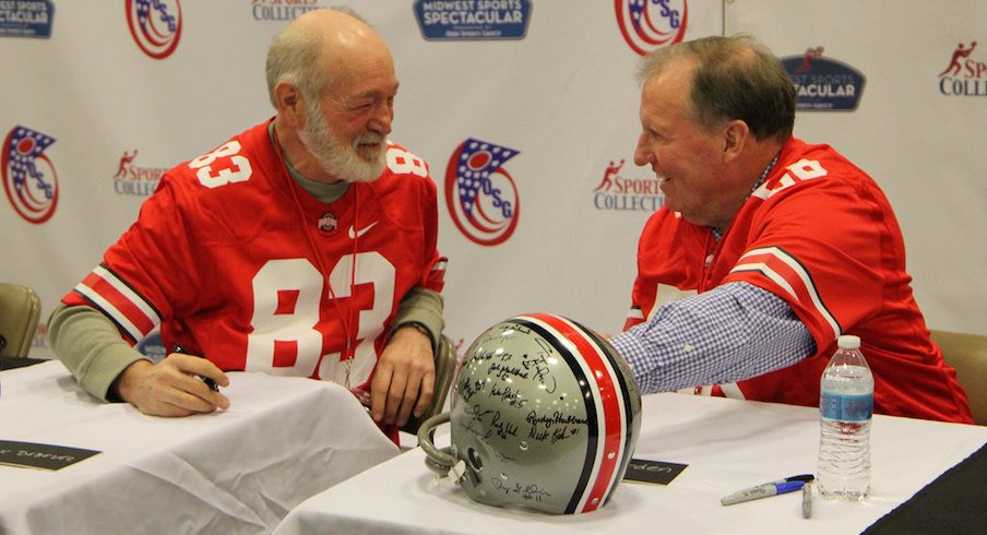 Former Ohio State defensive end Mark Debevc (83) and linebacker Dirk Worden (56), both members of the 1968 national championship team, at Saturday's autograph signing.