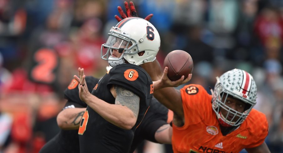 Tyquan Lewis pressures Virginia quarterback Kurt Benkert as he throws a pass in Saturday's Senior Bowl.