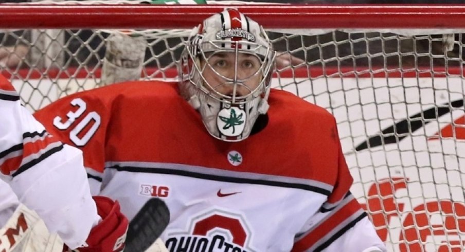 Buckeye goalie Sean Romeo locks in on the puck in a game against the Michigan Wolverines.