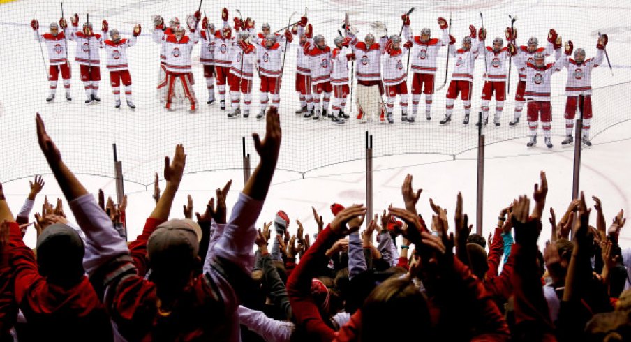 Ohio State men's hockey celebrates a win with the Buckeye students.