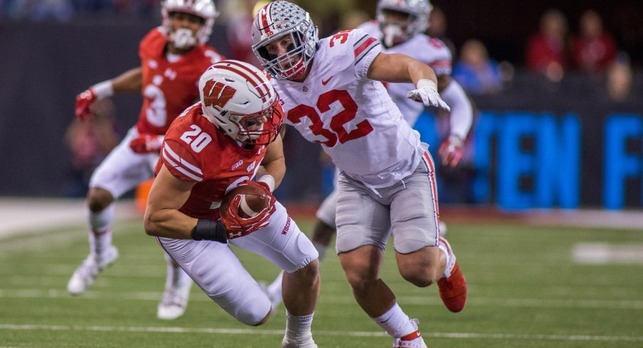 Middle linebacker Tuf Borland had seven stops versus Wisconsin in the Big Ten title game.