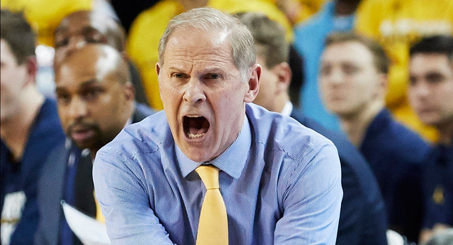 USA; Michigan Wolverines head coach  reacts on the sideline in the second half against the Northwestern Wildcats at Crisler Center. Mandatory Credit: 