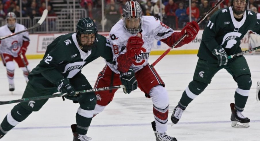 Dakota Joshua leads a Buckeye charge against the Michigan State Spartans.