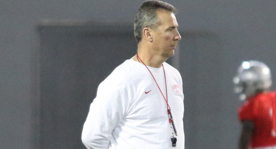 Urban Meyer watches closely during the first spring practice of the year.
