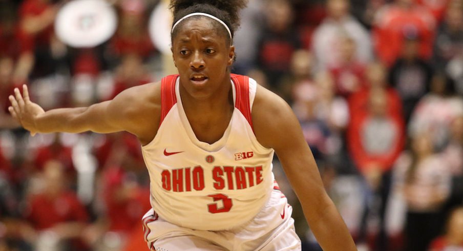 Kelsey Mitchell passes Jackie Stiles.