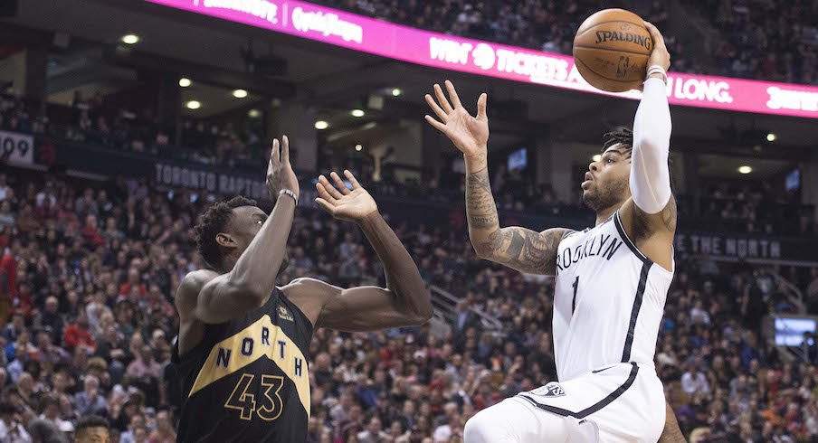 D'Angelo Russell driving to the basket against the Toronto Raptors.