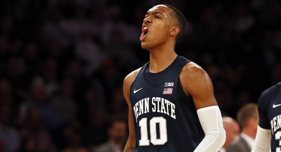 Tony Carr celebrates during Penn State's NIT championship game win over Utah.