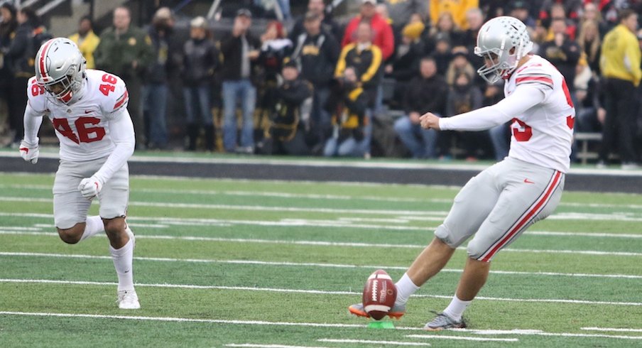 Blake Haubeil kicking off during Ohio State's 2017 game at Iowa.