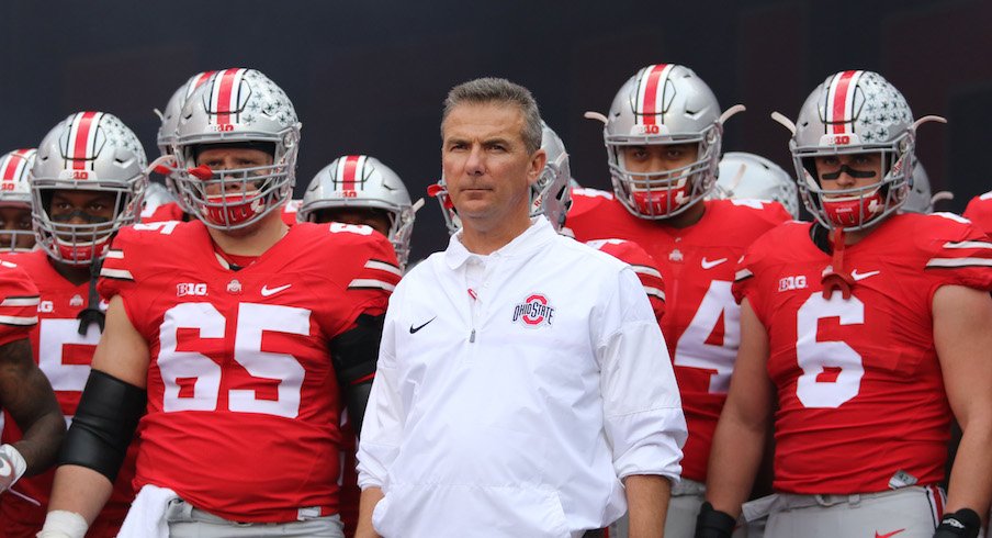 Urban Meyer and two players he redshirted.