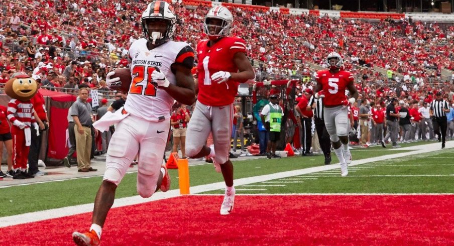 Oregon State Beavers running back Artavis Pierce (21) scores a touchdown against the Ohio State Buckeyes during the second half at Ohio Stadium.