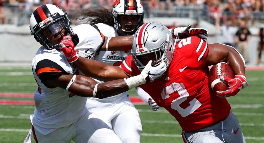 Ohio State's J.K. Dobbins breaks a tackle during Saturday's 77-31 win over Oregon State.