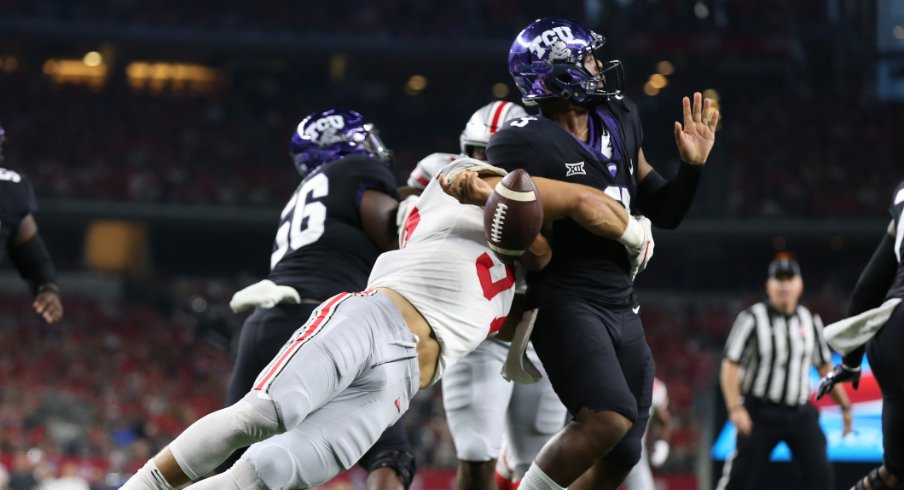 Texas Christian Horned Frogs quarterback Shawn Robinson (3) has the ball stripped by Ohio State Buckeyes defensive end Nick Bosa (97) at AT&T Stadium.