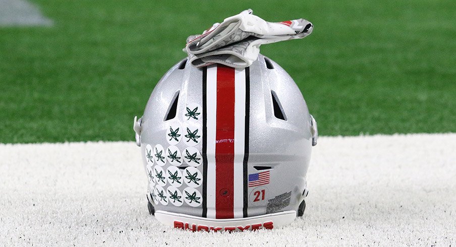 An Ohio State helmet sits on the field at AT&T Stadium.