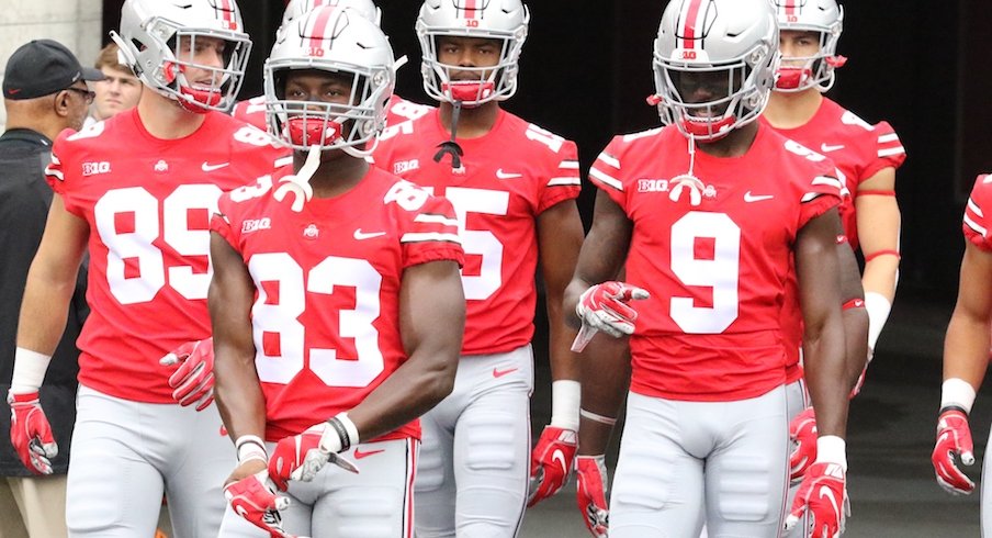 Terry McLaurin leads several of his teammates onto the field before Ohio State's game against Tulane.
