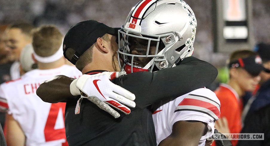 Brian Hartlin and Bin Victor embrace after Ohio State's comeback win over Penn State.