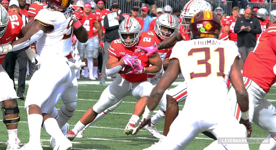 J.K. Dobbins tries to find a hole against Minnesota