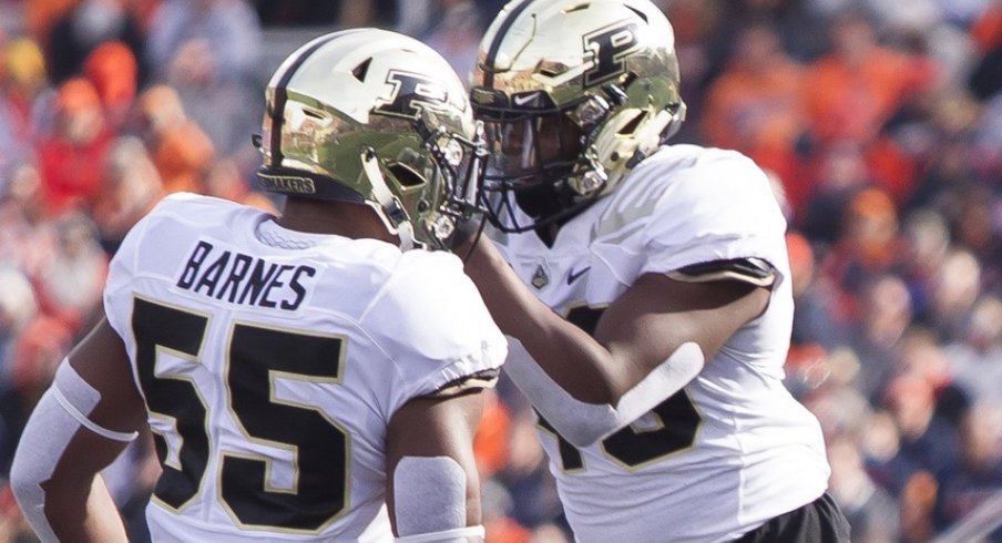 Oct 13, 2018; Champaign, IL, USA; Purdue Boilermakers linebackers Derrick Barnes (55) and Cornel Jones (46) celebrate after sacking Illinois Fighting Illini quarterback AJ Bush Jr. (1) during the second quarter at Memorial Stadium. Mandatory Credit: Mike Granse-USA TODAY Sports